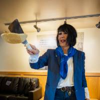 President Mantella flipping a pancake onto griddle.
